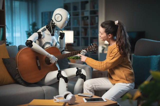 ギターを弾くロボットと人間